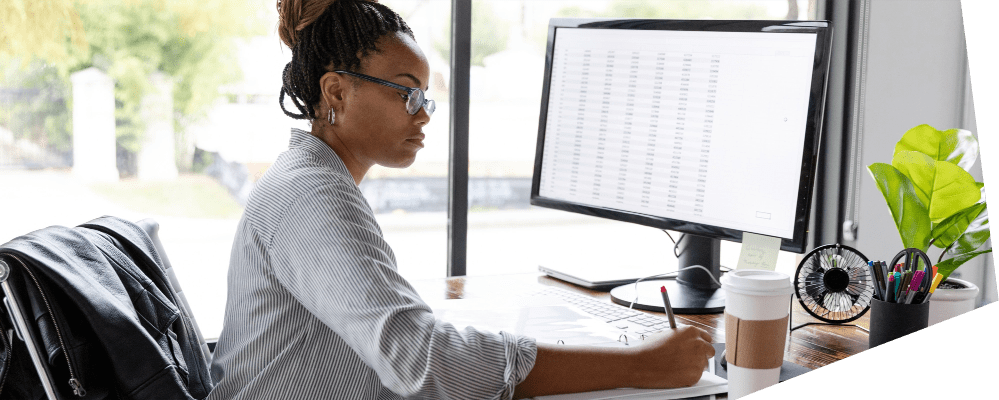 Approval for use required - Woman at computer in office